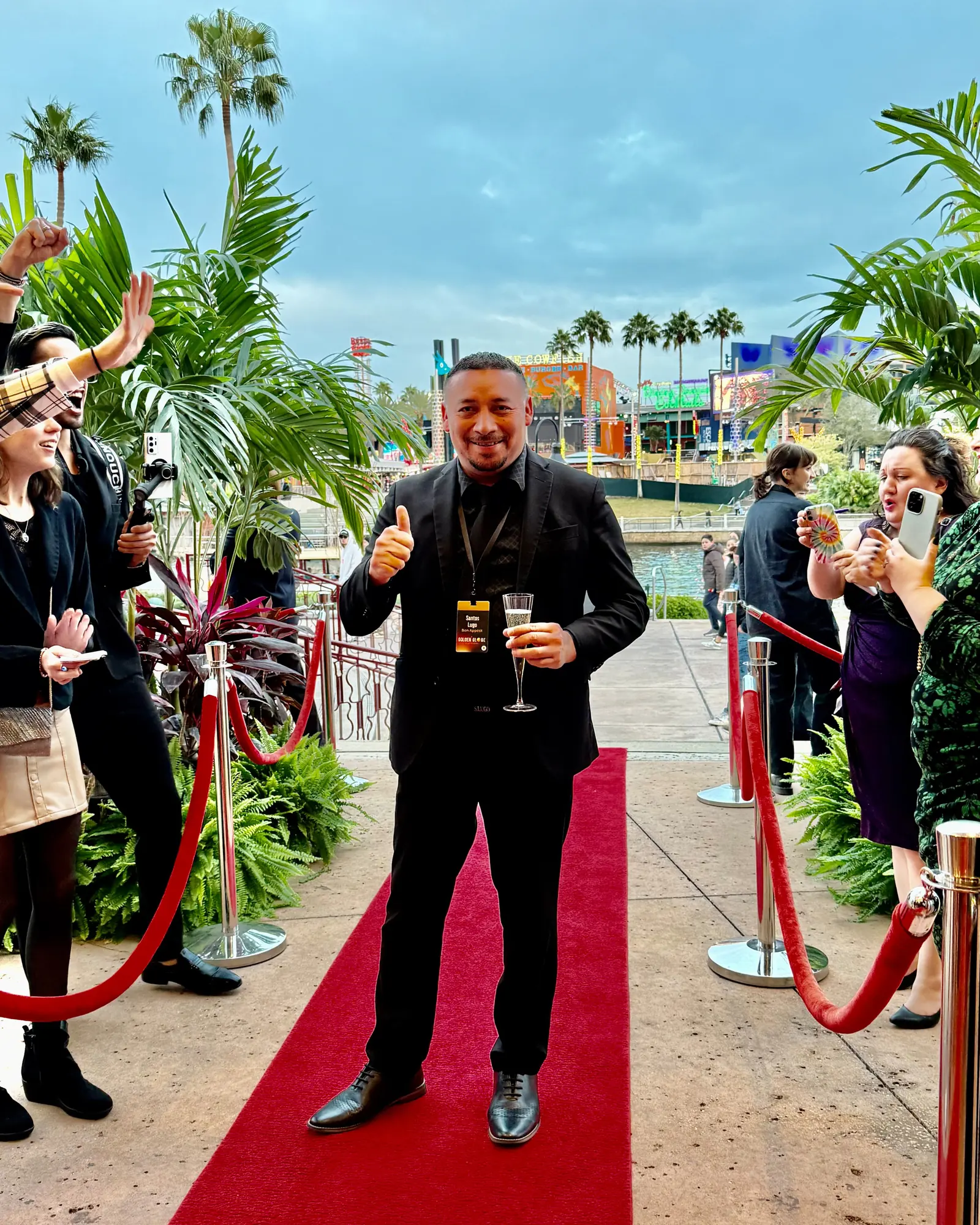 Chef Santos Lugo posing on the red carpet at the Golden Globe Awards