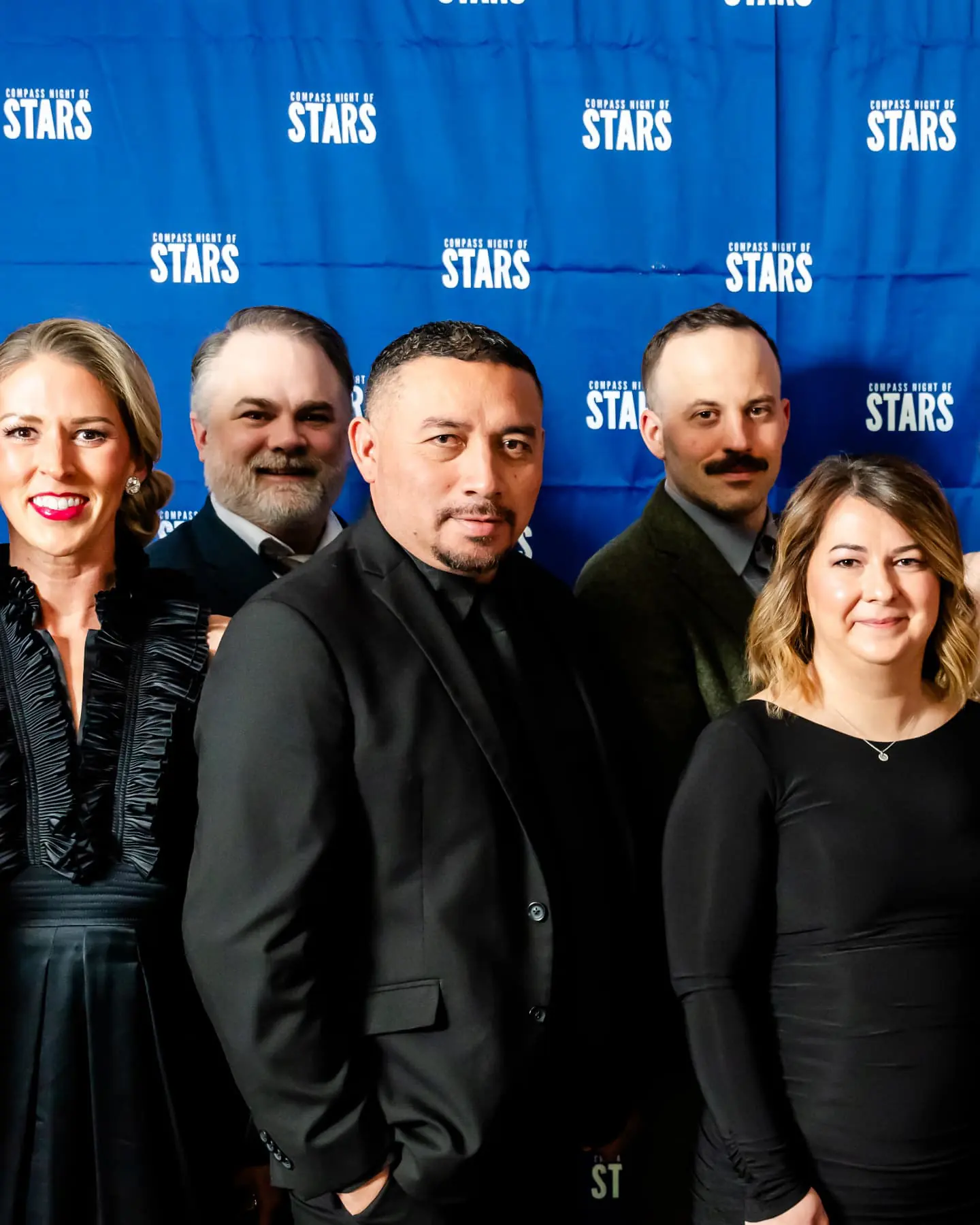 Chef Santos Lugo posing with fellow award recipients at the Golden Globe Awards